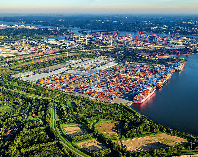 Aerial view of HHLA Container Terminal Altenwerder in Hamburg with container cranes and block storage.