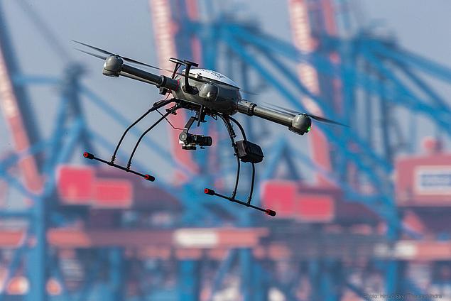 Industrial drone by HHLA Sky flying over a Hamburg terminal – used for inspection, monitoring and automated logistics coordination.